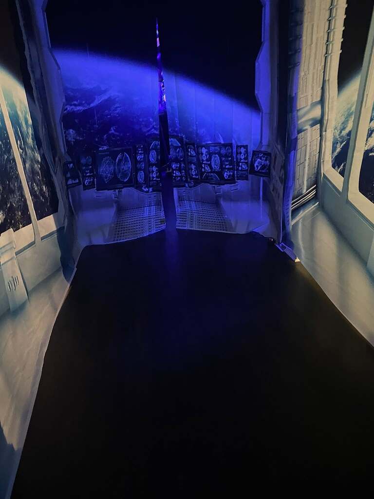 Space-themed wall tapestry depicting a futuristic cockpit view looking out at Earth from space.