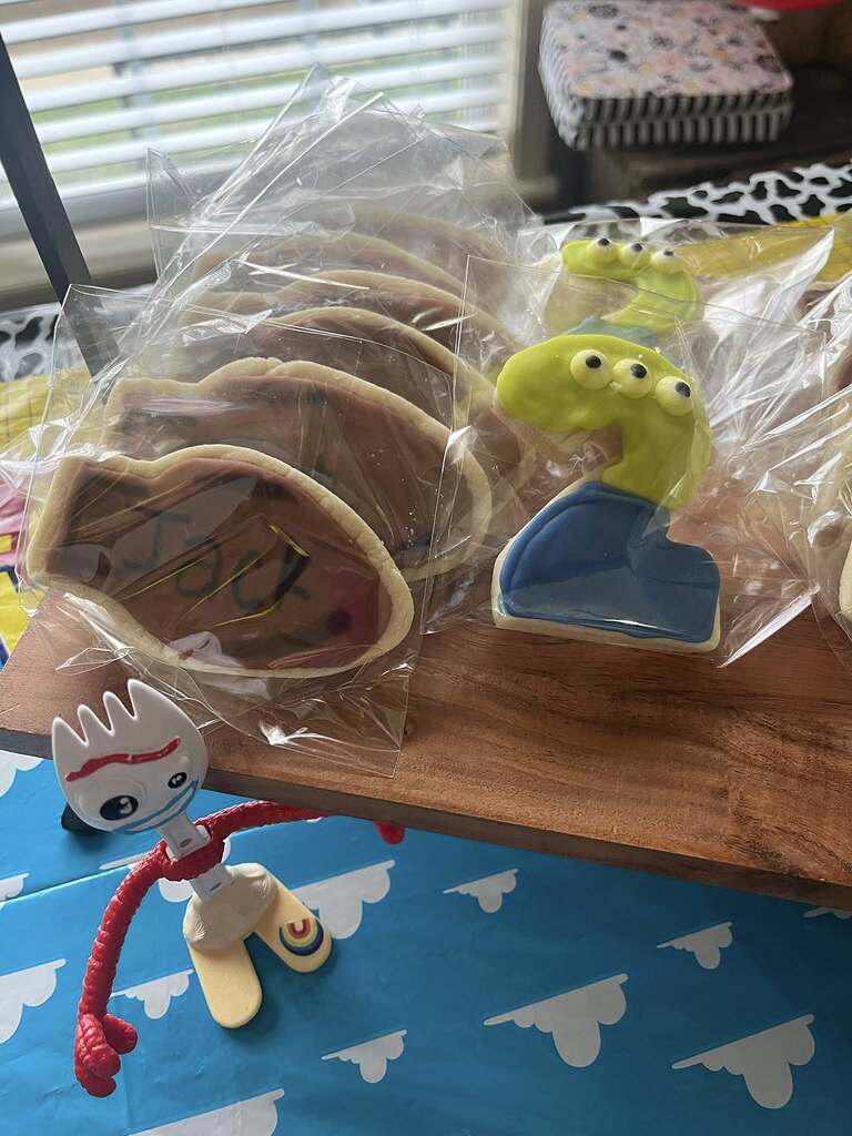 Toy Story inspired decorated sugar cookies served with a Forky toy figure.