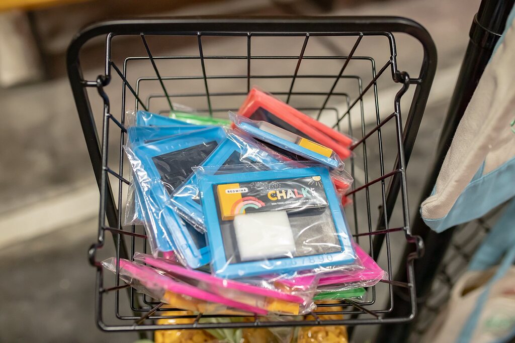 Basket filled with Bedwina individual chalkboard sets in clear plastic packaging