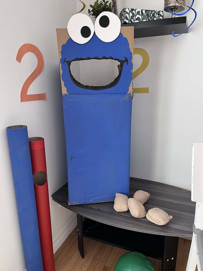 DIY blue Cookie Monster cardboard box bean bag toss game for birthday party