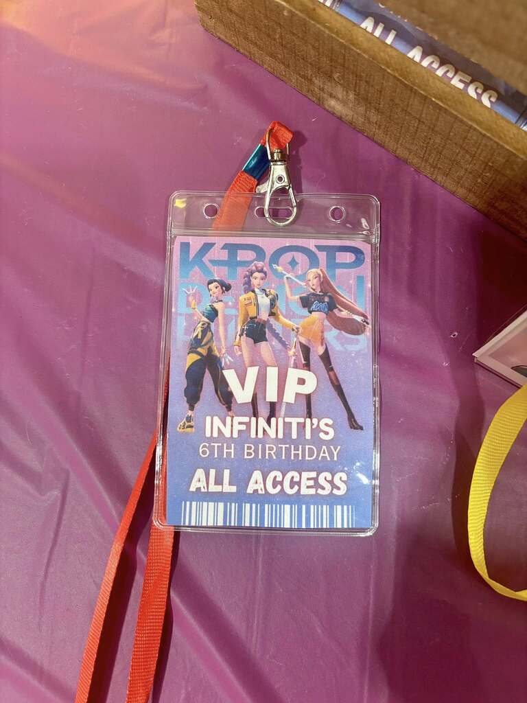 K-pop themed VIP birthday party all access badge with character art and red lanyard.